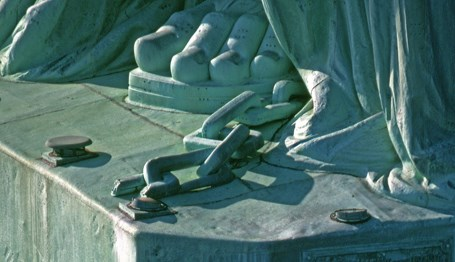 the chain at the feet of Lady Liberty
